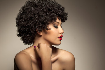 beautiful young woman with black curly wig