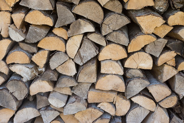 Chopped aspen firewood stacked up in a pile.