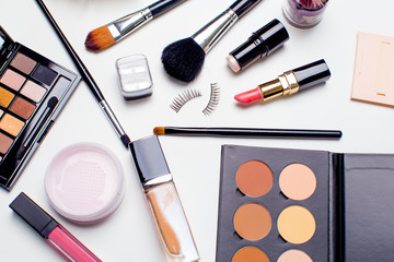 Brush and cosmetic isolated on a white background. Top view.