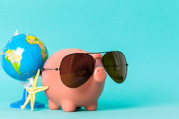 Piggy bank with sunglasses