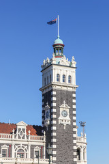 Obraz premium Dunedin Train Station Clocktower. This train station is a very popular tourist landmark in the South Island city in New Zealand.