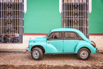 Vintage car in a paved street of Trinidad, Cuba