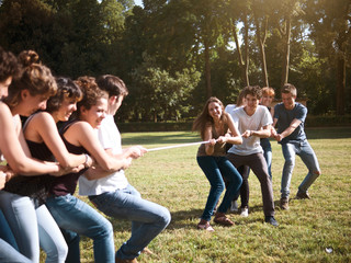 large group of friends together in a park having fun
