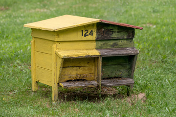 Wooden beehive with bees in a honey farm