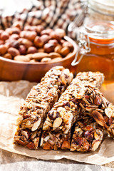 Healthy  protein granola bars with seeds and nuts on wooden back