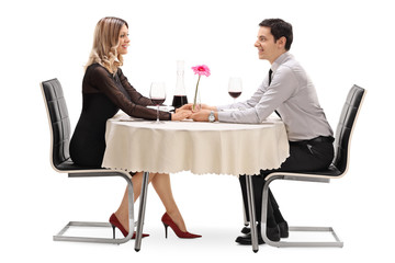 Happy couple sitting on a romantic date