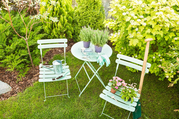 Spring garden - pastel green table with gardening tools