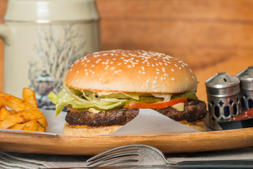 Cheeseburger served  with French Fries and Beer