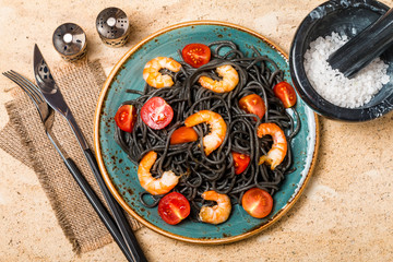 Black spaghetti with prawns and cherry tomatoes