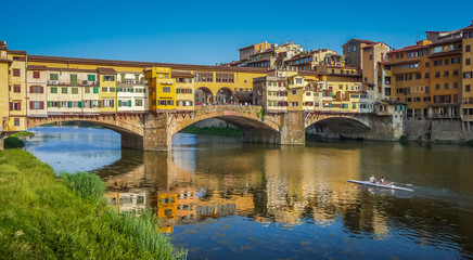 Fototapeta na wymiar Famous Ponte Vecchio with river Arno at sunset in Florence, Italy