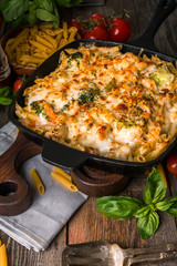 Baked pasta with broccoli, cauliflower, cheese and bechamel sauc