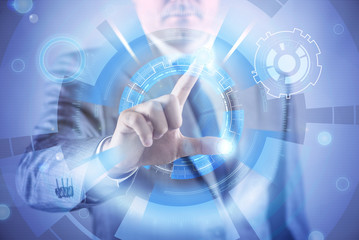 Businessman pressing virtual buttons in futuristic concept