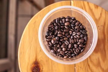 coffee beans in plastic cup 