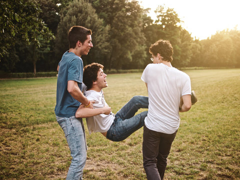 group of friends together in a park having fun