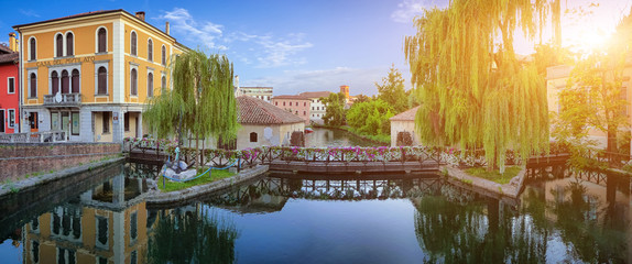 Romantic scene on Lemene river in Portogruaro at sunset, Italy