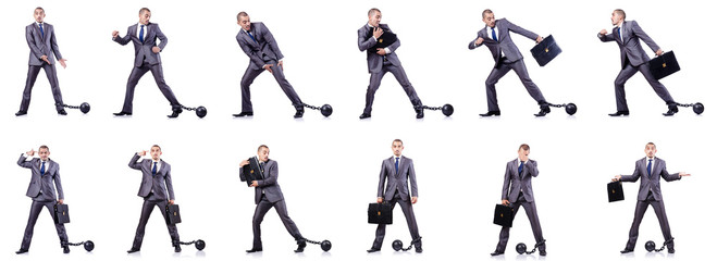 Businessman with shackles on white