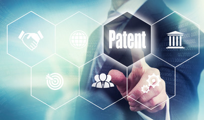 A businessman selecting a Patent Concept button