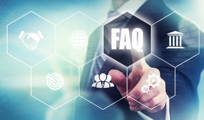 A businessman selecting a Frequently Asked Questions Concept but