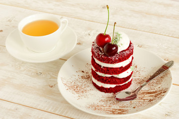 red cake with cherry
