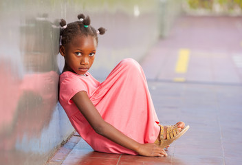 Primary school afro american girl frustrated in schoolyard
