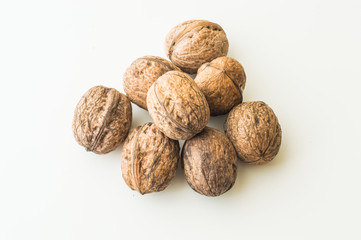 Walnuts in shell on a white background