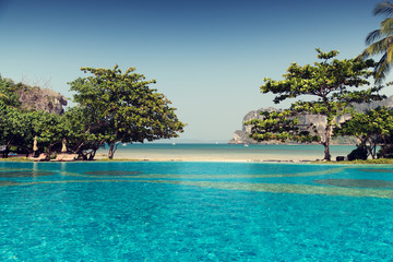 swimming pool at thailand touristic resort beach