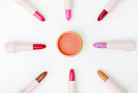 beautiful orange creamy blusher and various colors of lipsticks