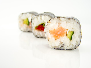 assorted delicious japanese traditional sushi over white 