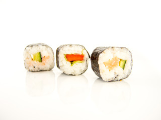 assorted delicious japanese traditional sushi over white 