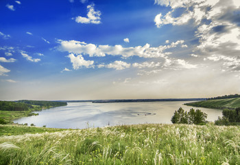 Landscape with lake, trees and sun