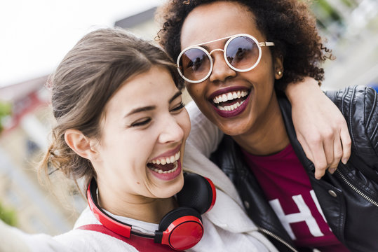 Portrait of two laughing best friends