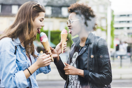 Two best friends eating icecream together