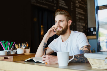 Coffee shop owner talking on the phone - small business concept