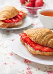 croissant with fresh strawberries, ricotta