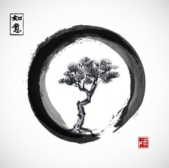 Pine tree in black enso zen circle. Traditional Japanese ink painting sumi-e. Contains hieroglyphs - dreams come true, well-being