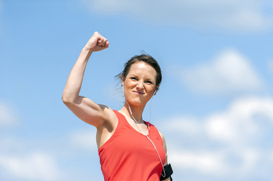 Fit woman happy of victory.
