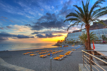 Atlantic beach of Gran Canaria island in Taurito at sunset, Spain
