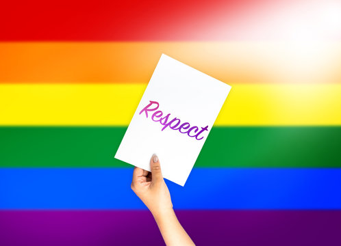 Right on card with hand holding; LGBT color flag background