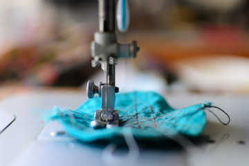 foot of the sewing machine in a work close-up