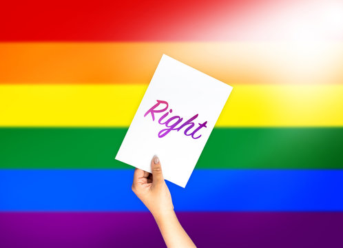 Right on card with hand holding; LGBT color flag background