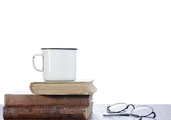 Books and white mug