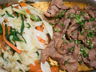 Beef with vegetables on hot plate, beef teppanyaki Japanese Cook