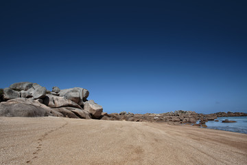 Fototapeta na wymiar Beach and Stones at the Pink Granite Coast in Brittany France