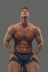 Fototapeta premium Male in a black panties looking up.