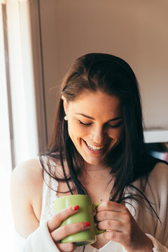 Young Sexy Woman Having a Coffee at Home