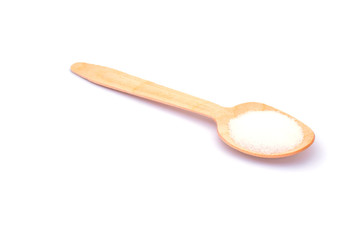 Salt in wooden spoons isolated on white