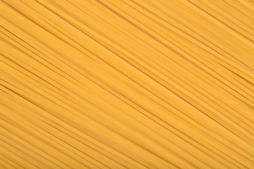 Uncooked Italian pasta spaghetti background