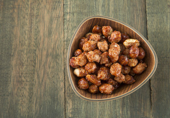 sugared peanuts on the wooden background