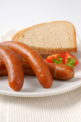 cooked sausages with bread