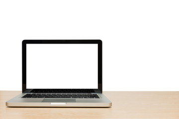 Open laptop with isolated white screen on wood